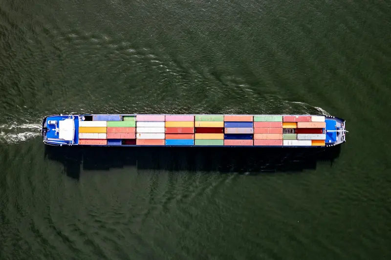 Aerial view of a loaded container vessel under way